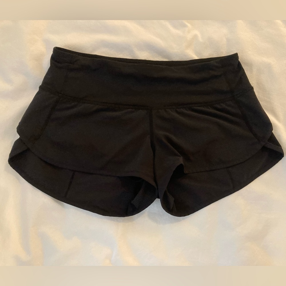 Black Lululemon speed shorts with waterproof packet
